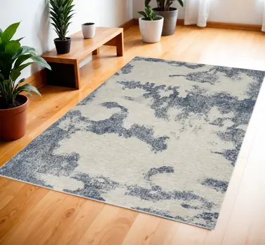 4' X 6' Light Blue and Ivory Abstract Non Skid Area Rug