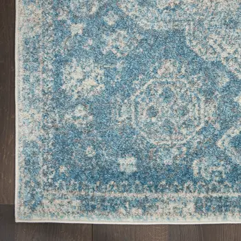 7' X 10' Ivory and Light Blue Geometric Distressed Area Rug