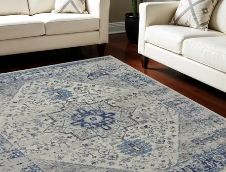 7' X 10' Ivory And Light Blue Floral Medallion Distressed Area Rug