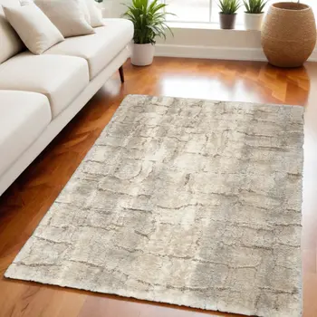 5' X 7' Beige and Ivory Abstract Shag Area Rug