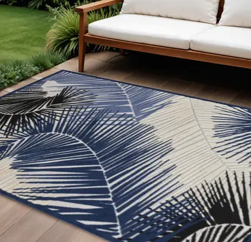 10' X 13' Navy Blue Black And Ivory Palm Leaf Indoor Outdoor Area Rug