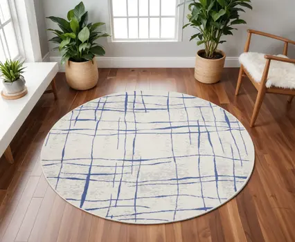 8' Ivory and Blue Abstract Distressed Round Rug