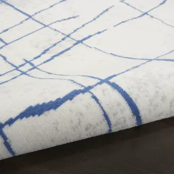 8' Ivory and Blue Abstract Distressed Round Rug
