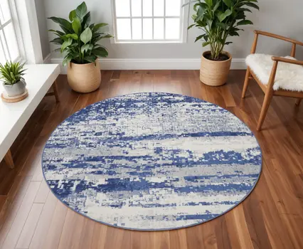8' Ivory and Navy Blue Abstract Round Rug