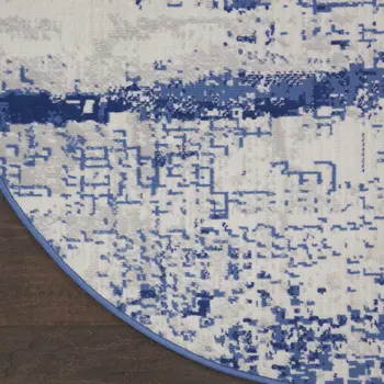 8' Ivory and Navy Blue Abstract Round Rug