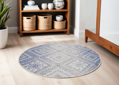 5' Ivory and Blue Geometric Distressed Round Rug