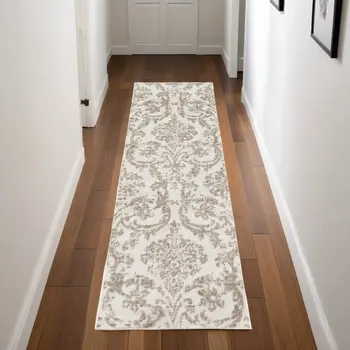 7' Beige and Ivory Damask Distressed Runner Rug