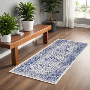 6' Ivory and Navy Blue Geometric Distressed Runner Rug