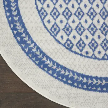 8' Ivory and Blue Geometric Distressed Round Rug