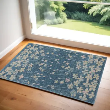 2' X 4' Turquoise and Cream Botanical Leaves Area Rug