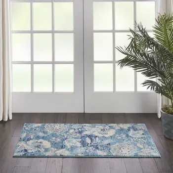 2' X 4' Turquoise Cream and Navy Blue Floral Distressed Area Rug