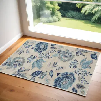 2' X 4' Ivory Navy Blue And Light Blue Floral Area Rug
