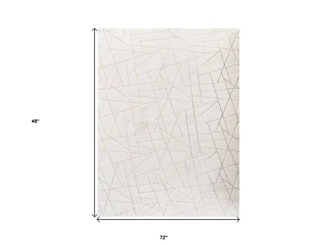 4' X 6' White and Gold Faux Fur Abstract Shag Non Skid Area Rug