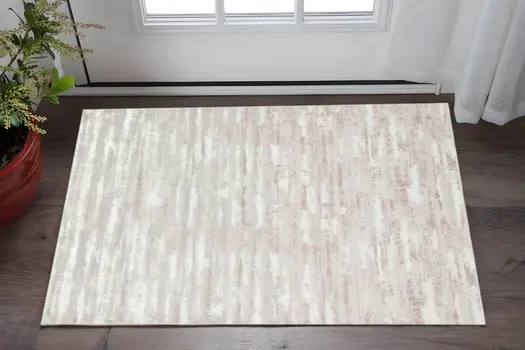 3' X 5' Pink Beige And Off White Abstract Washable Area Rug