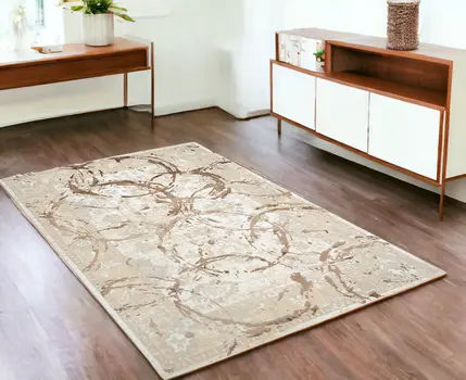 4' X 6' Beige and Gold Abstract Area Rug