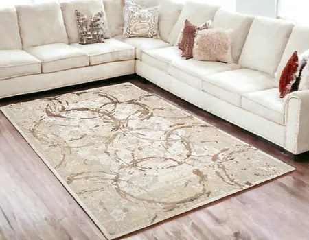 5' X 8' Beige and Gold Abstract Area Rug