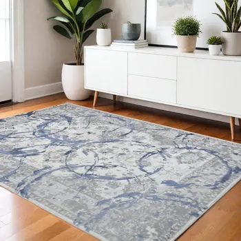 4' X 6' Ivory Blue And Gray Abstract Area Rug