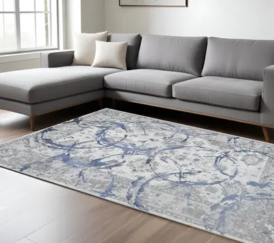 8' X 11' Ivory Blue And Gray Abstract Area Rug