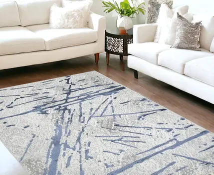 5' X 8' Ivory and Blue Abstract Area Rug