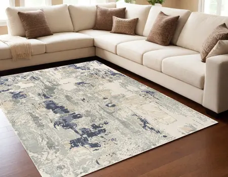5' X 8' Blue and Beige Abstract Area Rug