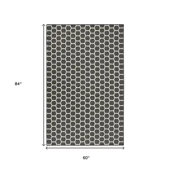 6' X 9' Black And Ivory Geometric Indoor Outdoor Area Rug