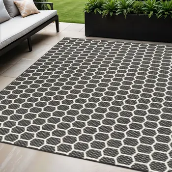 5' X 7' Black And Ivory Geometric Indoor Outdoor Area Rug