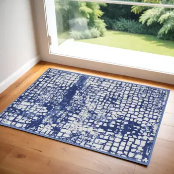 2' X 3' Ivory and Navy Blue Abstract Area Rug