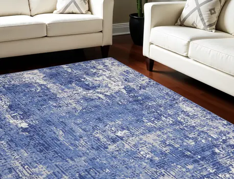 7' X 10' Ivory and Blue Abstract Distressed Area Rug