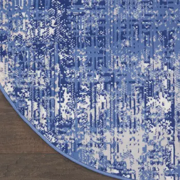 8' Ivory and Blue Abstract Distressed Round Rug
