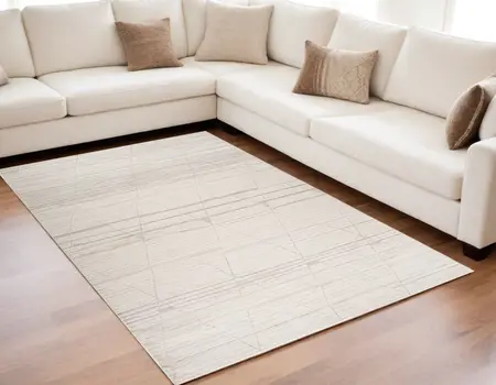 5' X 8' Cream and Beige Abstract Area Rug