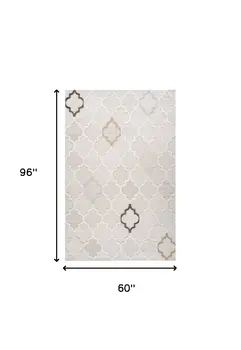 5' X 8' Cream and Beige Geometric Distressed Area Rug