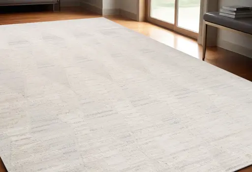 5' X 8' Cream and Beige Geometric Distressed Area Rug