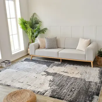 5' X 8' Beige and Black Abstract Distressed Area Rug