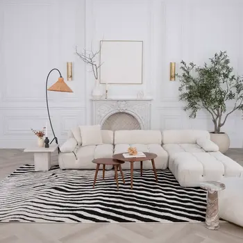 7' X 10' Cream and Black Abstract Worn Faded Area Rug