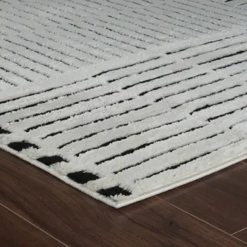 8' X 11' Cream and Black Abstract Distressed Area Rug