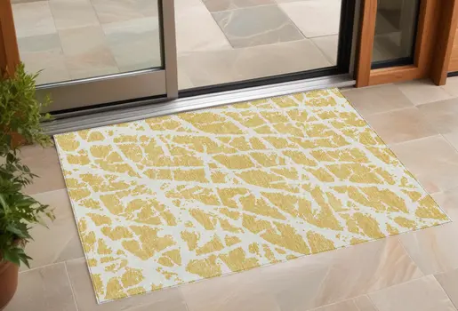 2' X 3' Gold and White Abstract Washable Non Skid Indoor Outdoor Area Rug