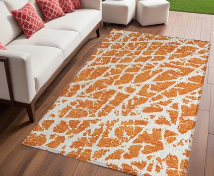 5' X 8' Orange and White Abstract Washable Non Skid Indoor Outdoor Area Rug