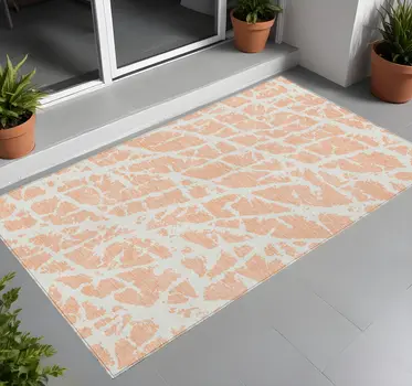 2' X 3' Peach and Ivory Abstract Washable Non Skid Indoor Outdoor Area Rug