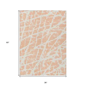 3' X 5' Peach and Ivory Abstract Washable Non Skid Indoor Outdoor Area Rug