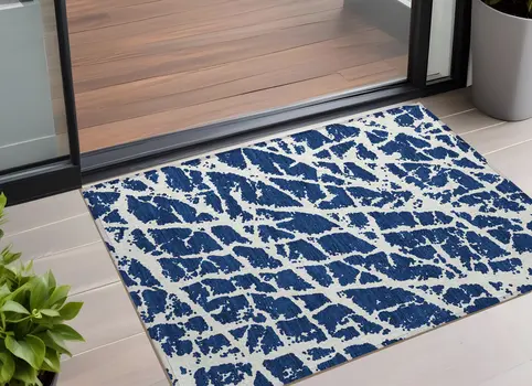 2' X 3' Navy and Ivory Abstract Washable Non Skid Indoor Outdoor Area Rug