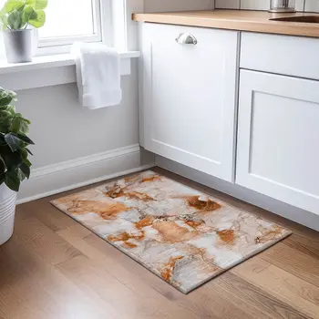 2' X 3' Orange and Ivory Abstract Washable Indoor Outdoor Area Rug