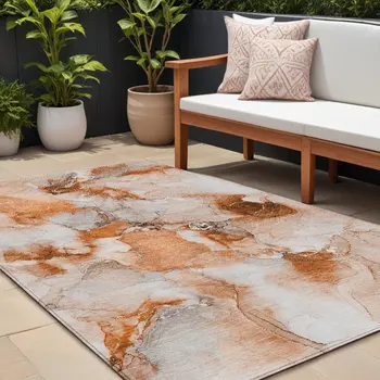 9' X 12' Orange and Ivory Abstract Washable Non Skid Indoor Outdoor Area Rug