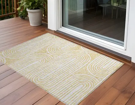 2' X 3' Gold and White Abstract Washable Non Skid Indoor Outdoor Area Rug