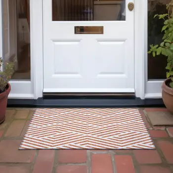 2' X 3' Orange and White Geometric Washable Non Skid Indoor Outdoor Area Rug