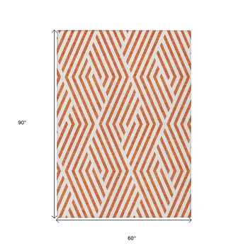 5' X 8' Orange And White Geometric Washable Indoor Outdoor Area Rug