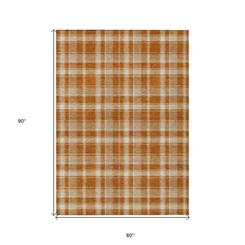 5' X 8' Orange and Ivory Plaid Washable Non Skid Indoor Outdoor Area Rug