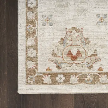 8' X 10' Cream Floral Power Loom Distressed Area Rug With Fringe