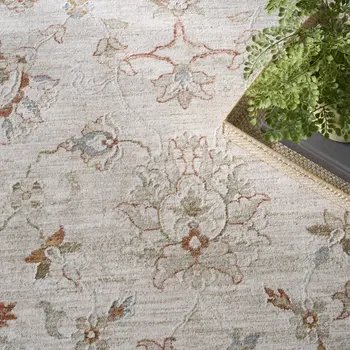 8' X 10' Cream Floral Power Loom Distressed Area Rug With Fringe