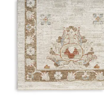 8' X 10' Cream Floral Power Loom Distressed Area Rug With Fringe
