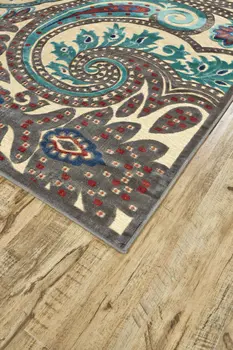 8' X 11' Tan Blue and Taupe Paisley Power Loom Area Rug